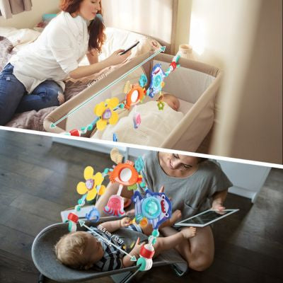 Arc d’activité bébé installé sur un lit et un berceau avec jouets sensoriels, accessoire d’éveil favorisant la motricité, la coordination et l’attention